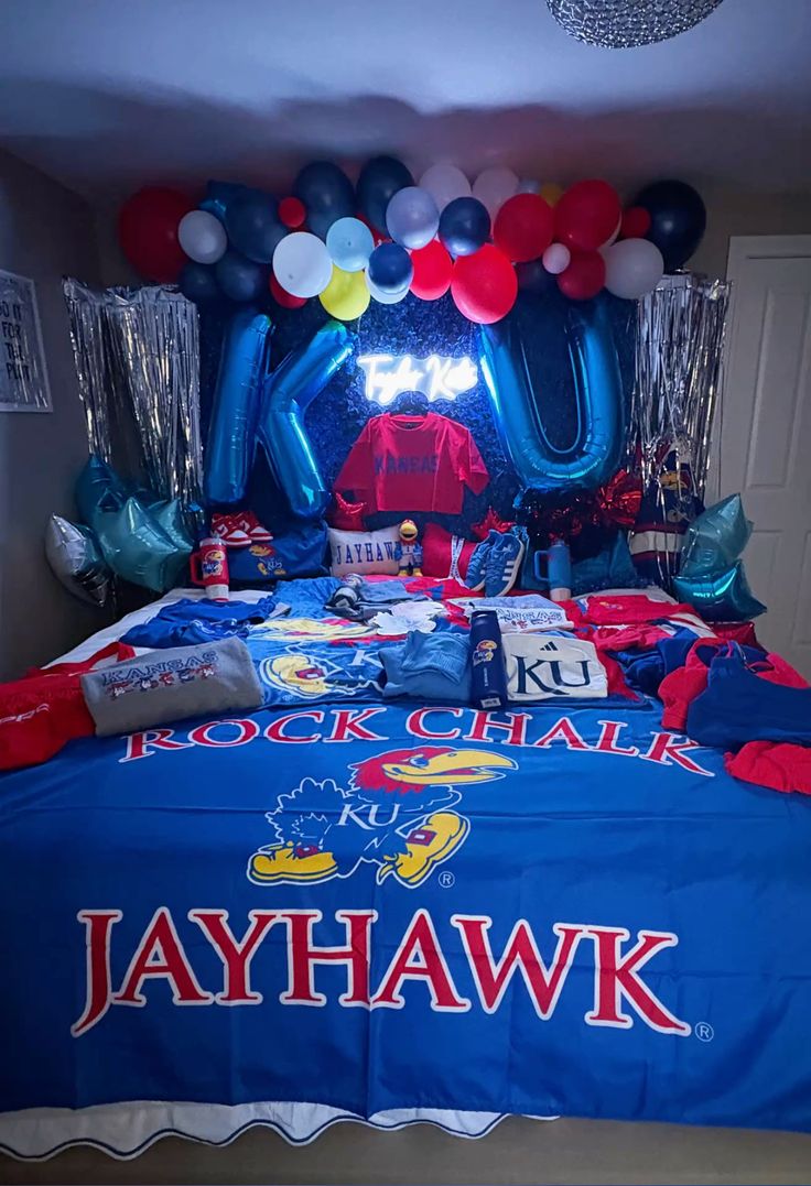 University of Kansas bed party with KU balloon letters, red white and blue balloons