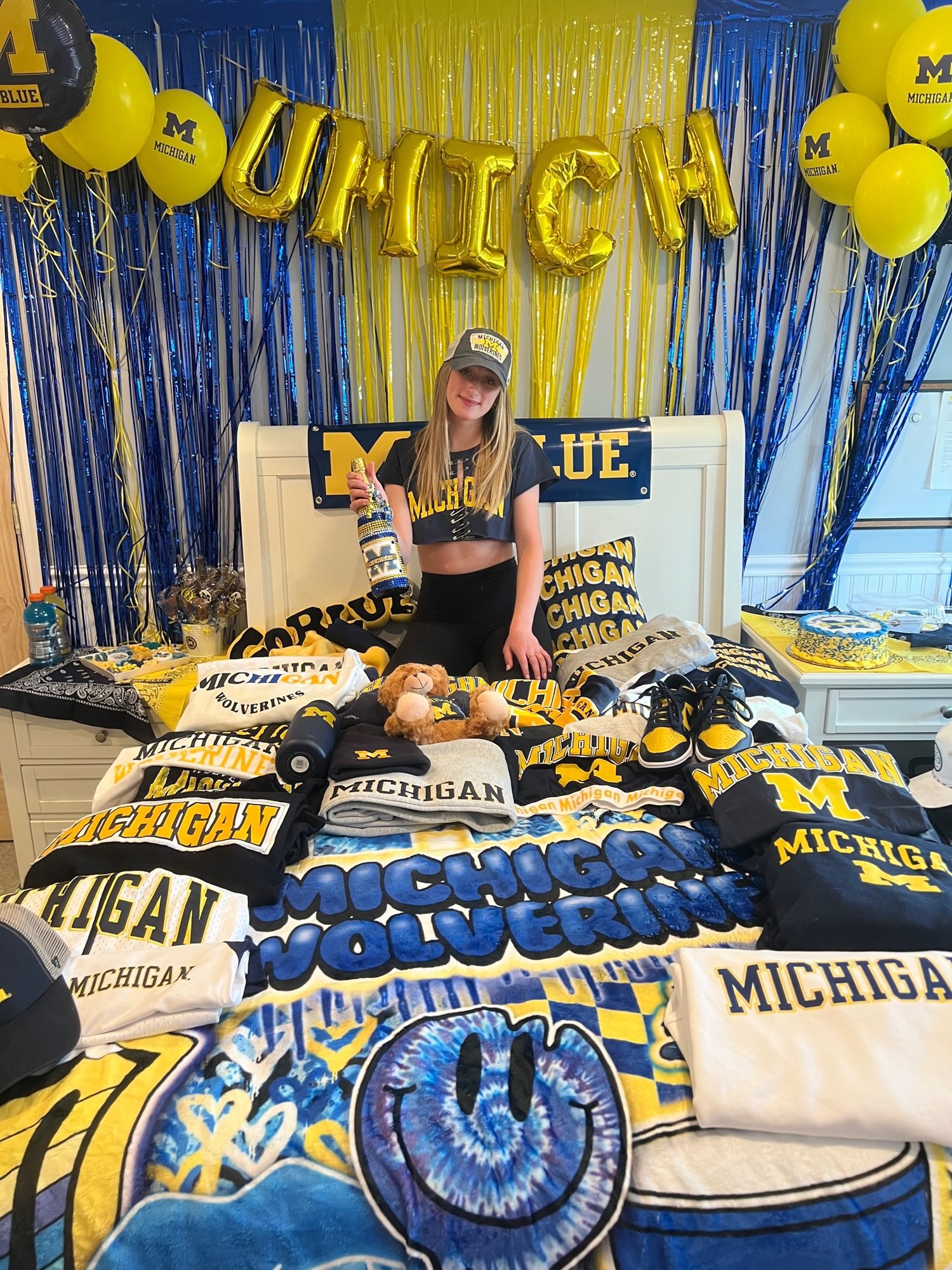 Michigan Wolverines bed party showcase with maize and blue decorations